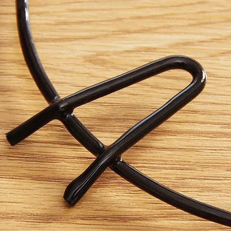 Black metal gas stove pot holder kitchen burner rack