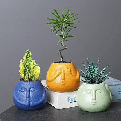 Blue and orange ceramic abstract human face planter living room decor
