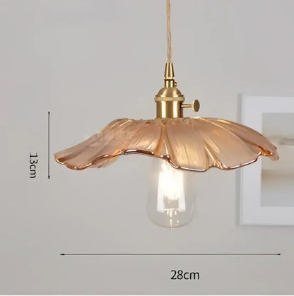 Blue translucent glass pendant lights with brass fixture bedroom