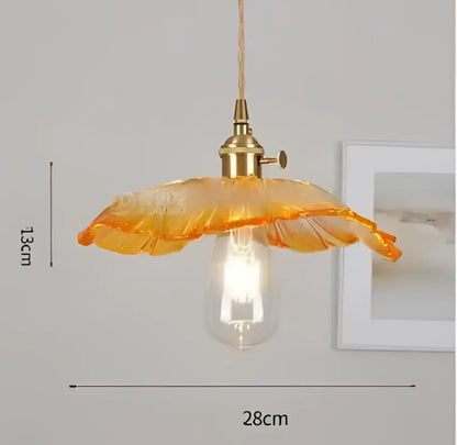 Blue translucent glass pendant lights with brass fixture bedroom