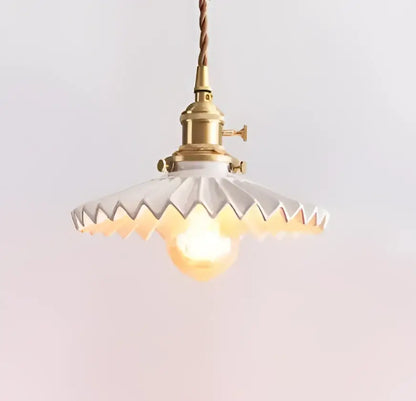 Blue translucent glass pendant lights with brass fixture bedroom