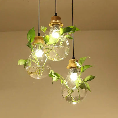 Botanical glass bottle pendant light kitchen clear wood accents