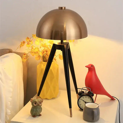 Brass and black coyote gold tripod floor lamp for living room
