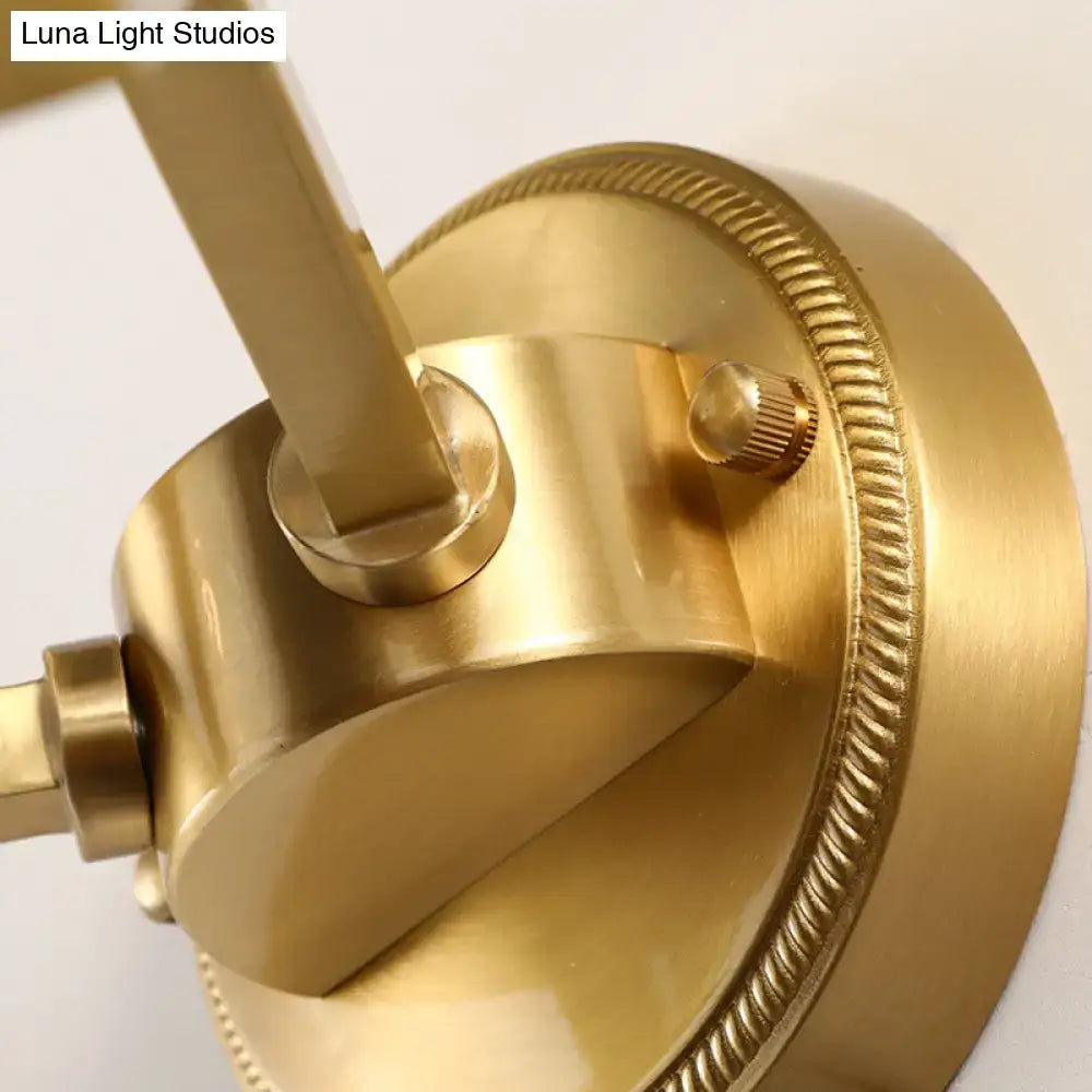 Brass ball sconce with ribbed glass shade for bedroom wall lighting