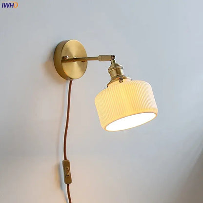 Brass ribbed ceramic wall sconce with iron arm bedroom light