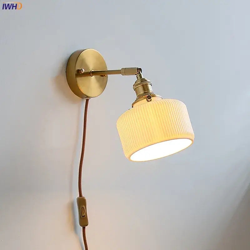 Brass ribbed ceramic wall sconce with iron arm bedroom light