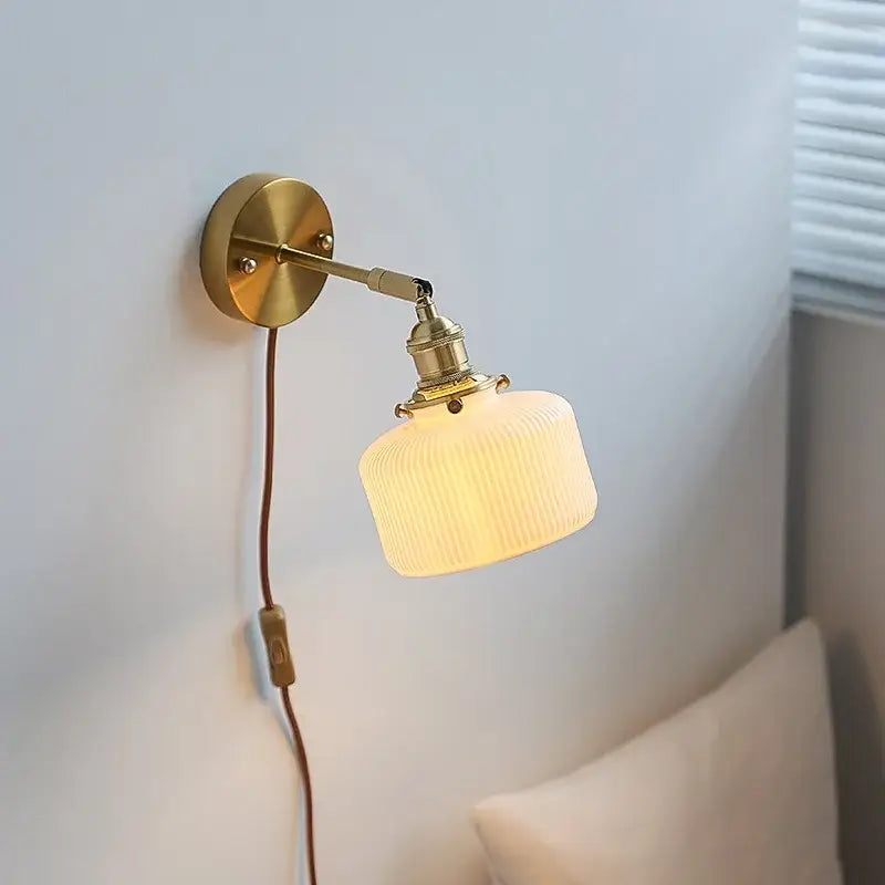 Brass ribbed ceramic wall sconce with iron arm bedroom light