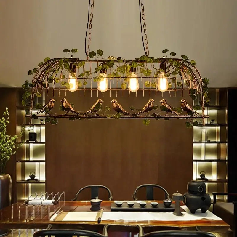 Bronze birdcage pendant lights with garland for dining room