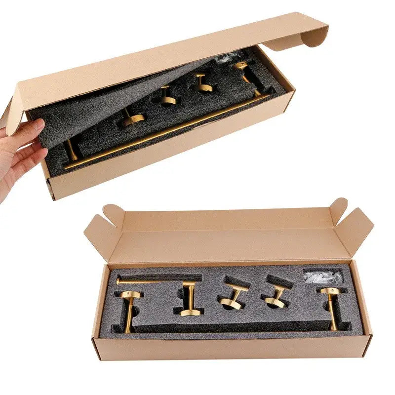 Brushed gold bathroom hardware set with towel bar and robe hooks