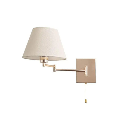 Brushed nickel adjustable rocker arm wall lamp with cream shade bedroom