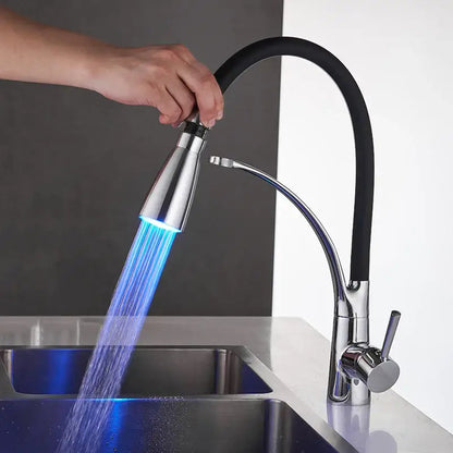 Brushed nickel and black kitchen sink faucet with pull down spray