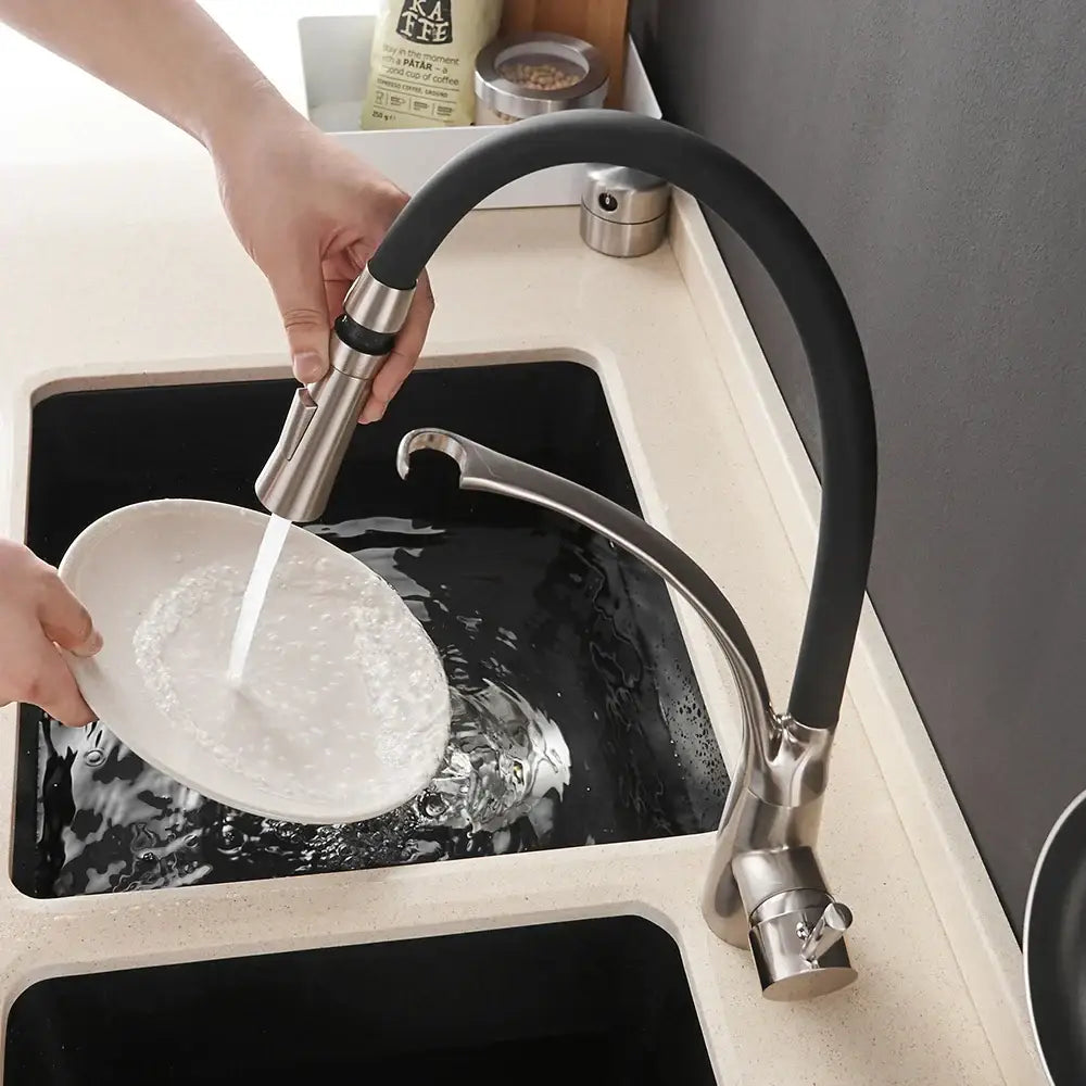 Brushed nickel and black kitchen sink faucet with pull down spray
