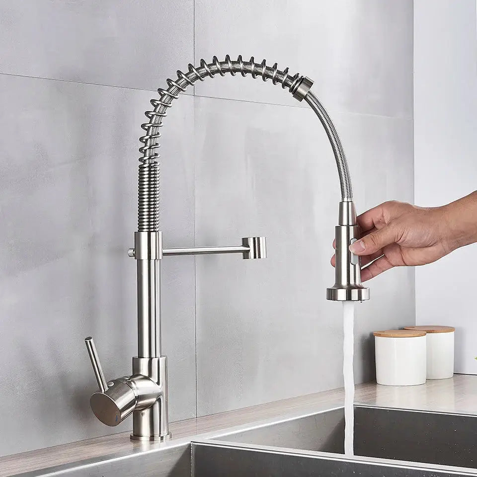 Brushed nickel coiled spring kitchen faucet with pull down sprayer