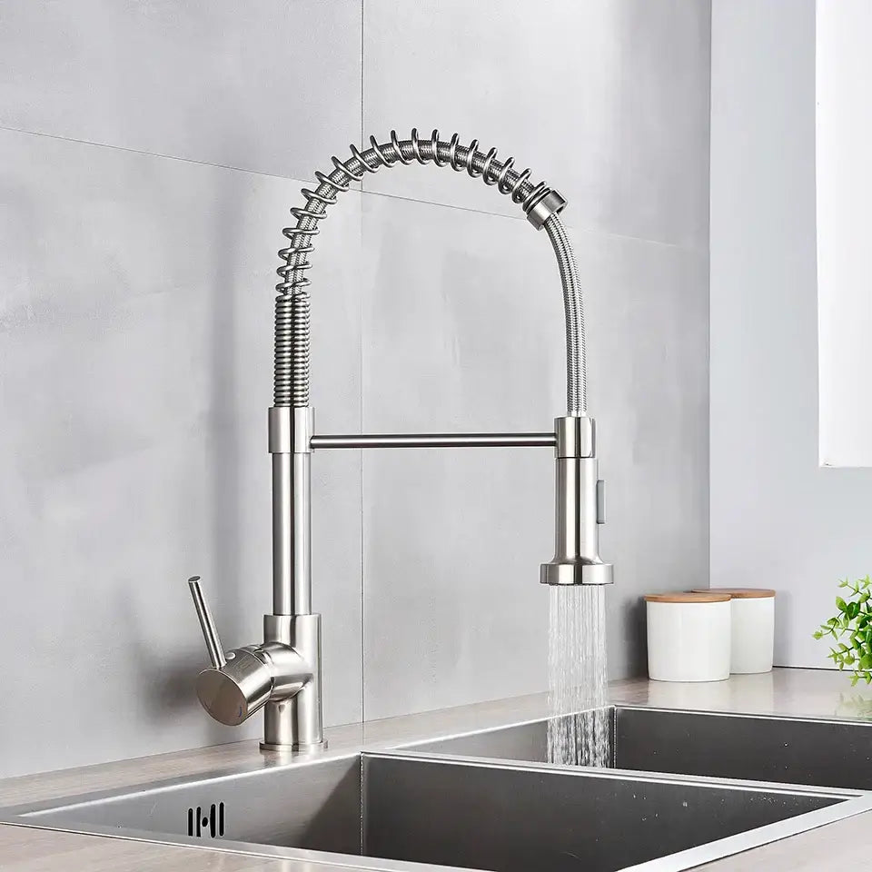 Brushed nickel coiled spring kitchen faucet with pull down sprayer