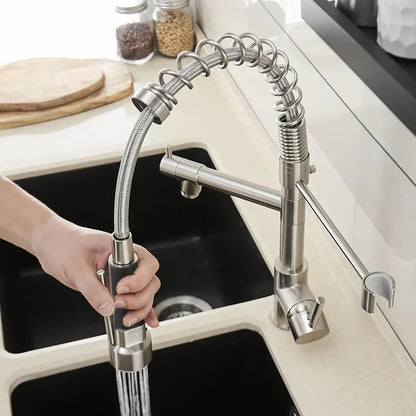 Brushed nickel kitchen faucet with spring hose and spray head
