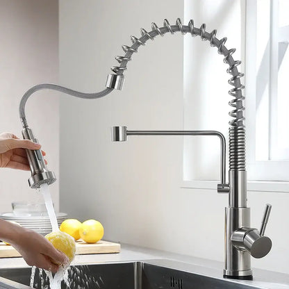 Brushed nickel sensor kitchen faucet with flexible pull down spray