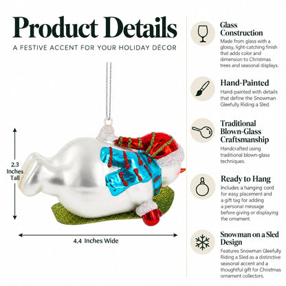 Snowman Gleefully Riding a Sled Glass Christmas Ornament