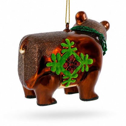 Brown Bear Holding a Poinsettia Glass Christmas Ornament
