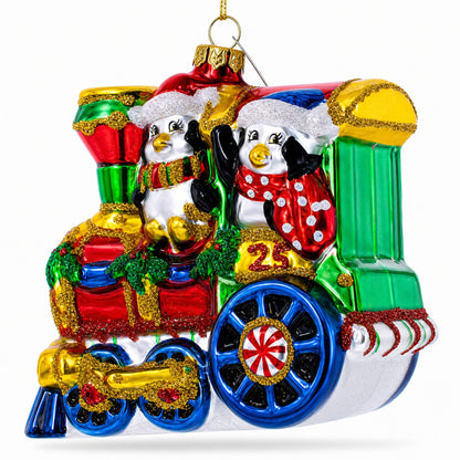 Playful Penguins Riding Train Glass Christmas Ornament