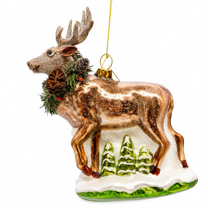 Reindeer with Pine Garland and Snowy Trees Glass Christmas Ornament