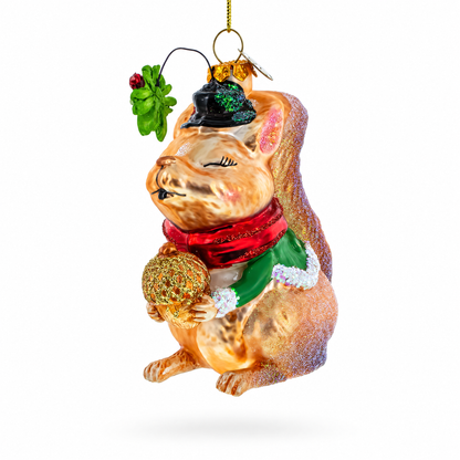 Squirrel Cradling an Acorn Glass Christmas Ornament