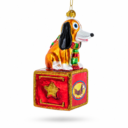 Playful Toy Dog on Festive Red Box Glass Christmas Ornament