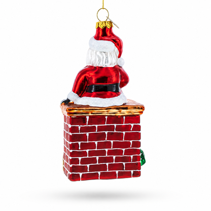 Santa Delivering Presents Down the Chimney Glass Christmas Ornament