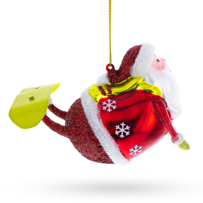 Santa Snowboarding Glass Christmas Ornament