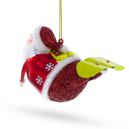 Santa Snowboarding Glass Christmas Ornament