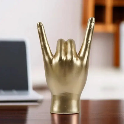 Chic black glossy rock hand gesture sculpture living room decor