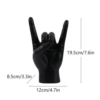 Chic black glossy rock hand gesture sculpture living room decor