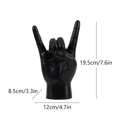 Chic black glossy rock hand gesture sculpture living room decor