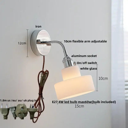 Chrome adjustable arm wall lamp with ribbed glass shade – bedroom