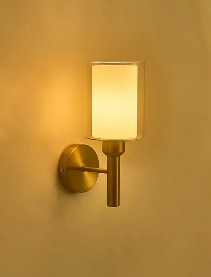 Classic brass glass wall sconce with frosted shade for bedroom