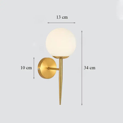 Classic brass glass wall sconce with frosted shade for bedroom