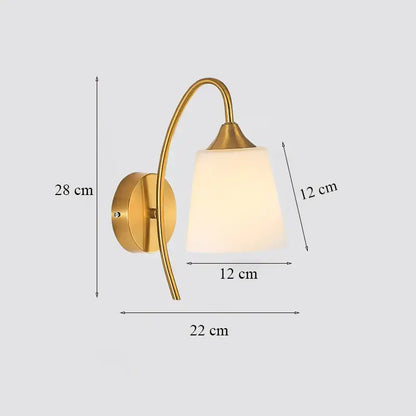 Classic brass glass wall sconce with frosted shade for bedroom