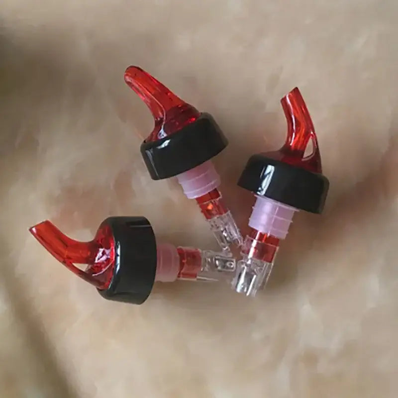 Clear and red plastic liquor pourer bottle dispenser kitchen barware