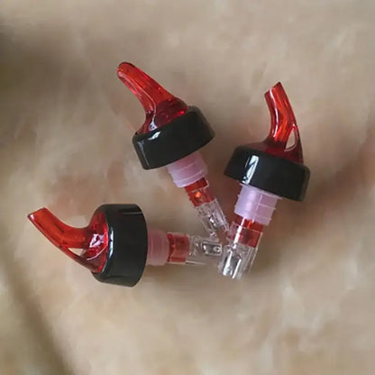 Clear and red plastic liquor pourer bottle dispenser kitchen barware