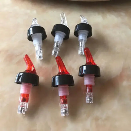 Clear and red plastic liquor pourer bottle dispenser kitchen barware