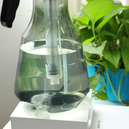 Clear and teal hand trigger watering sprayer garden planting accessory