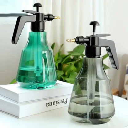 Clear and teal hand trigger watering sprayer garden planting accessory