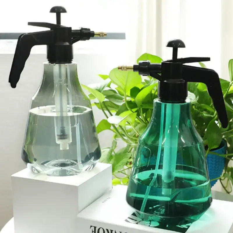 Clear and teal hand trigger watering sprayer garden planting accessory