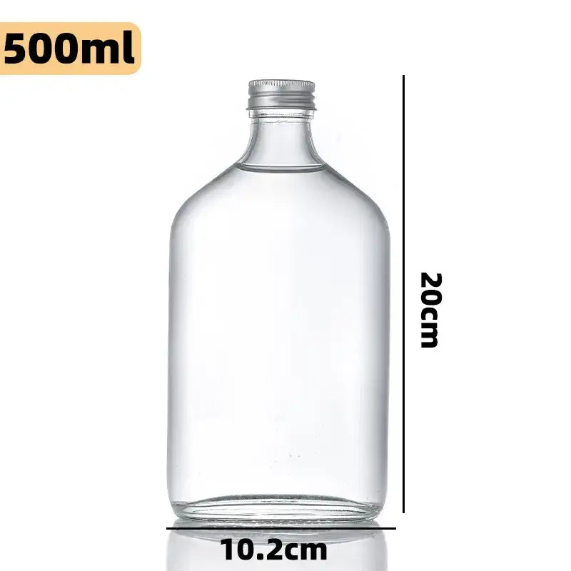 Clear glass beverage bottles with silver caps – kitchen juicing set