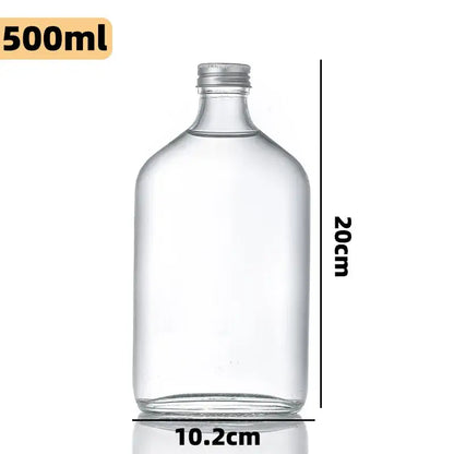 Clear glass beverage bottles with silver caps – kitchen juicing set