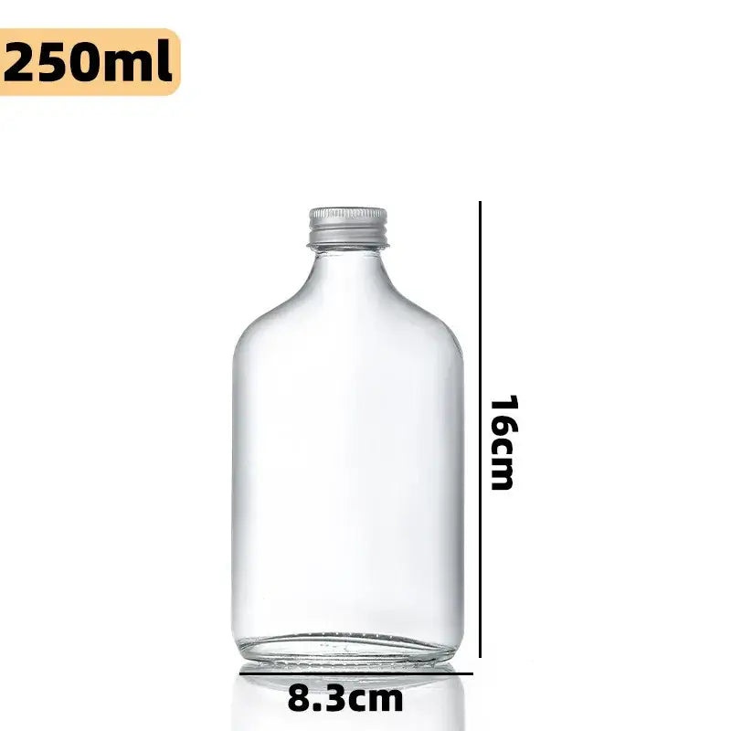 Clear glass beverage bottles with silver caps – kitchen juicing set