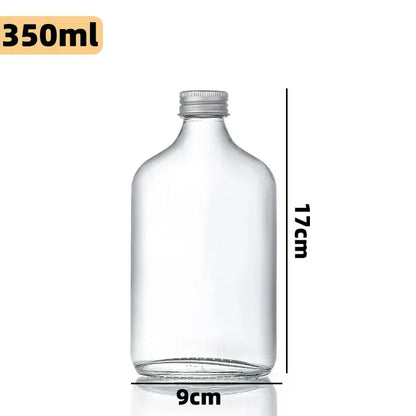 Clear glass beverage bottles with silver caps – kitchen juicing set