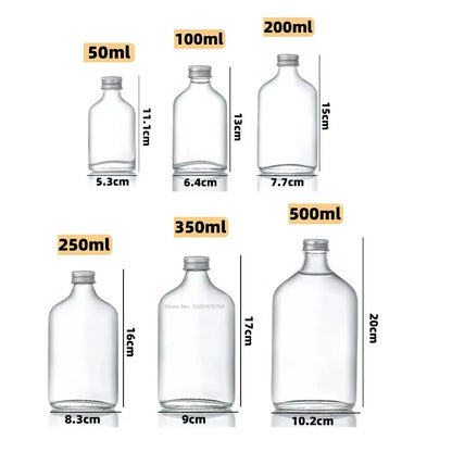 Clear glass beverage bottles with silver caps – kitchen juicing set