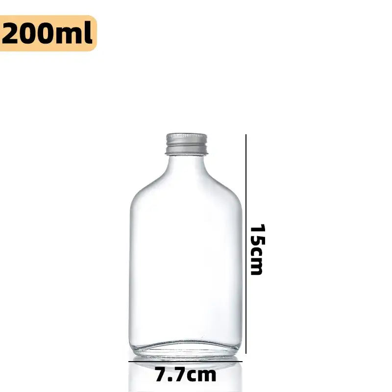 Clear glass beverage bottles with silver caps – kitchen juicing set