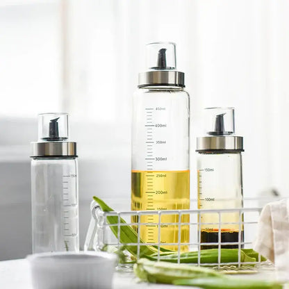Clear glass condiment bottle set with measurements for kitchen