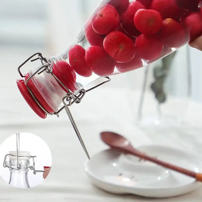 Clear glass storage bottle with swing top lid for kitchen storage